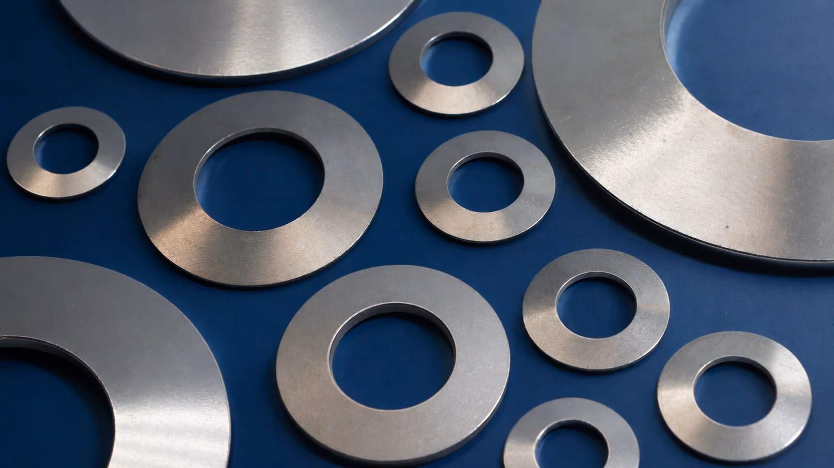 Inconel 718, 625 & X-750 Disc Spring Supplier with blue industrial background
