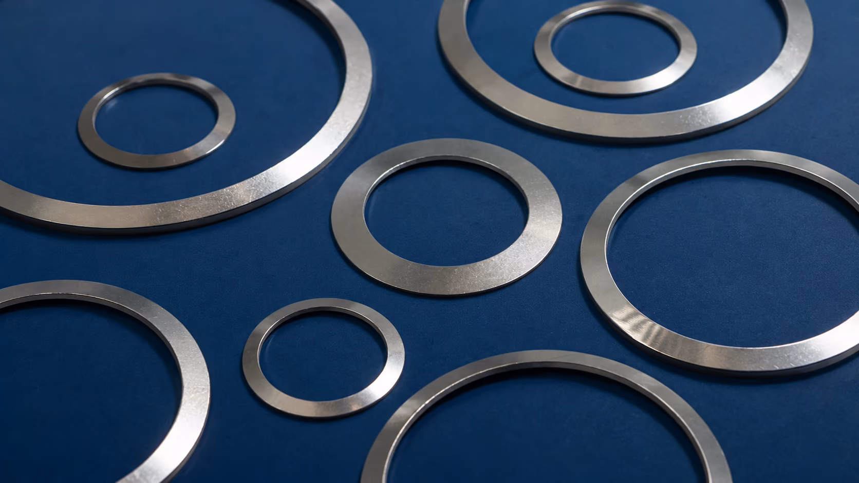 Valve Disc Springs | Live Loading & Actuator Spring RFQ with blue industrial background